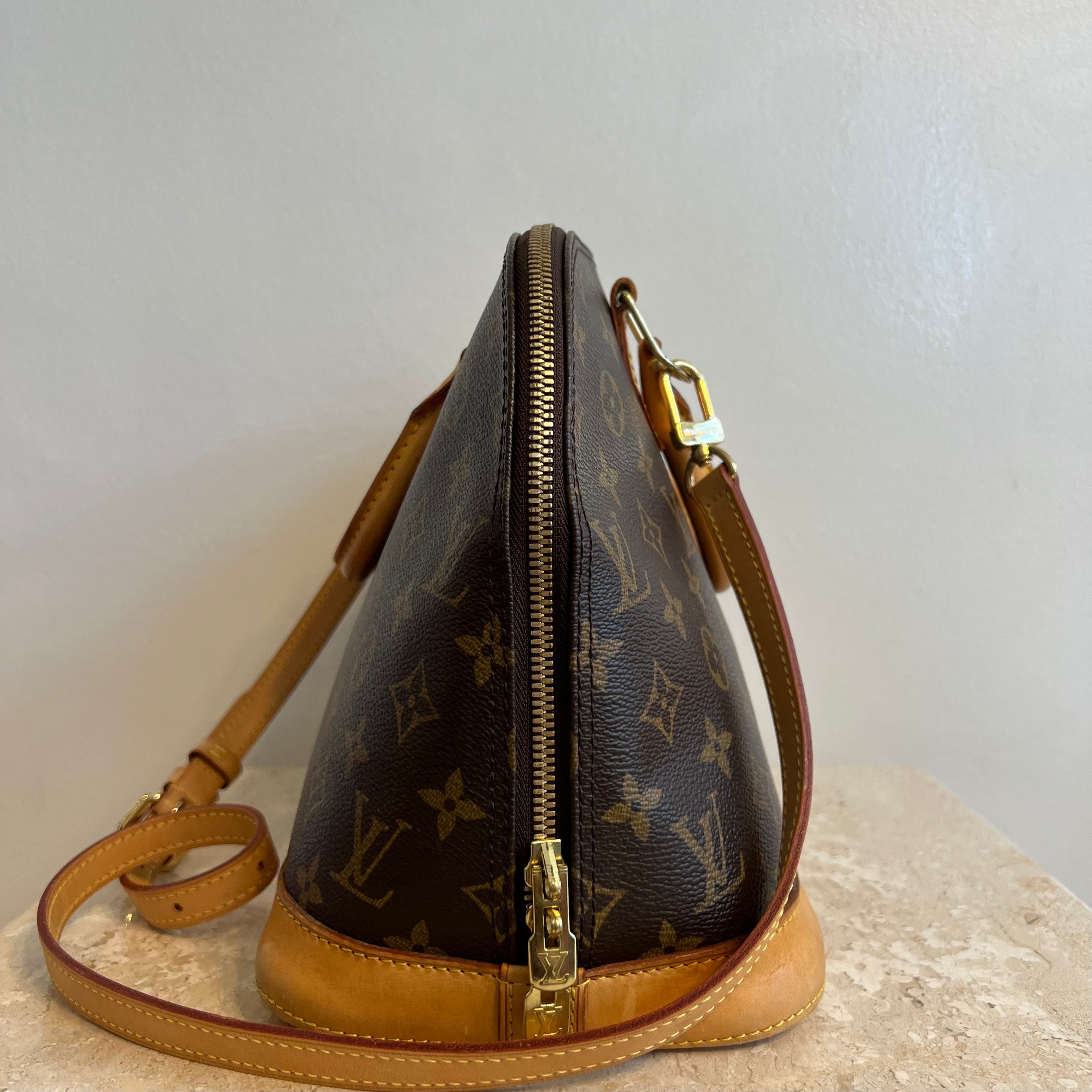 Pre-Owned Louis Vuitton Alma PM Brown Handbag 